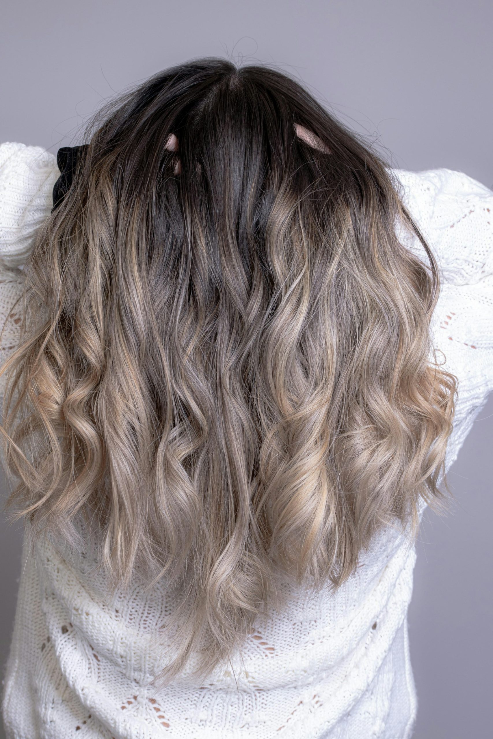 A balayage hair color result, painted highlights blended through the lengths.